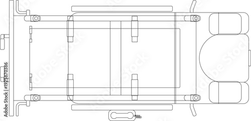 Architectural CAD block of a high-tech medical examination bed or surgical table in top view, featuring detailed technical outlines and mechanical components.