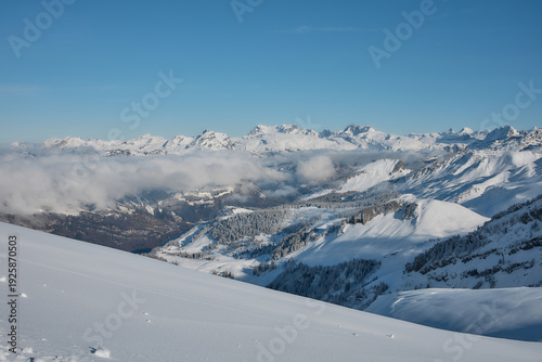 Snow covered alpine ridge with ski tracks, Stoos Switzerland