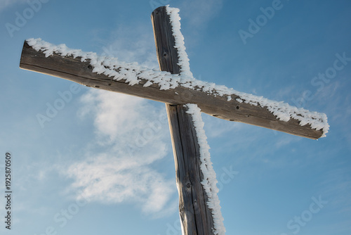 Frost covered summit cross in Swiss Alps, Stoos