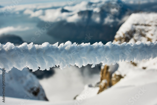 Snow covered alpine ridge with dramatic clouds, Stoos Switzerland