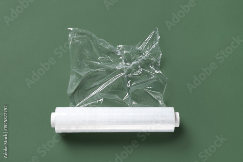 Roll of stretch wrap on gre...