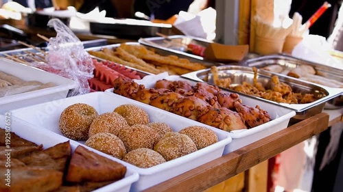 Traditional Chinese snacks and fried sesame balls at a street market