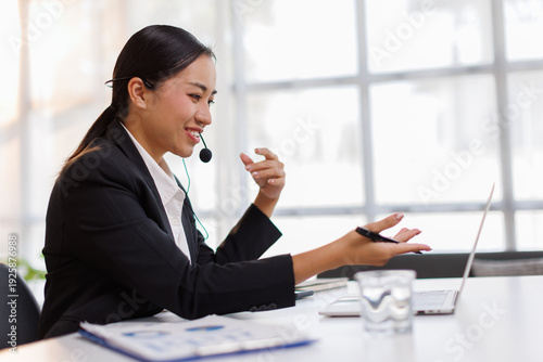 Photos Portrait of woman working in call center