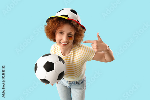 Young female sports fan wit...