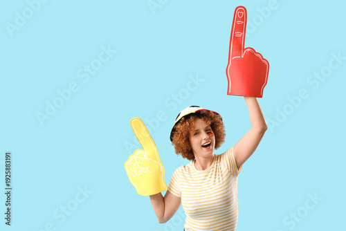 Young female soccer fan wit...