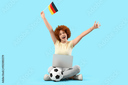 Young female soccer fan wit...
