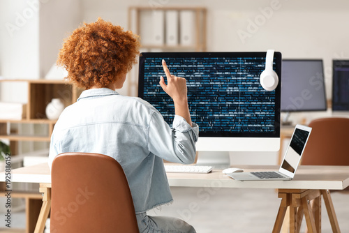 Young female programmer wor...