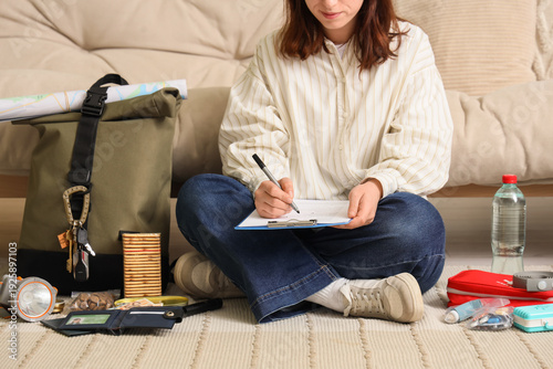 Young woman with check list...