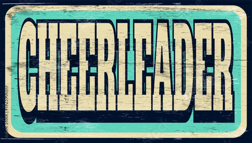 Aged and worn cheerleader sign on wood