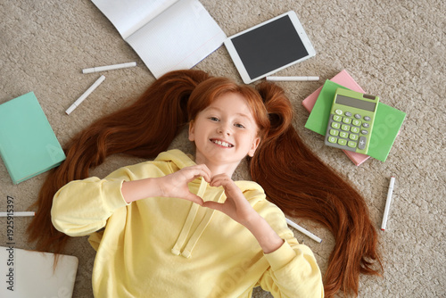 Little student making heart...