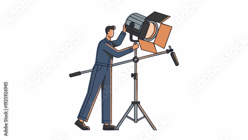 Man adjusting professional film lighting equipment on set.