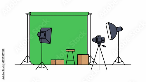 Photography studio setup with green screen and lighting equipment.