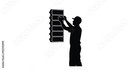 Silhouette of a man installing a solar panel