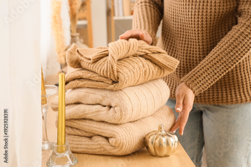 Woman with stack of stylish...
