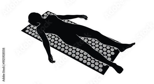 Black silhouette of a person lying on a reflexology mat