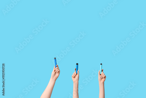 Many hands holding electron...