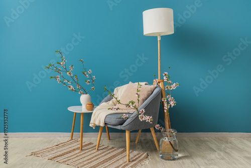 Grey armchair and vases wit...