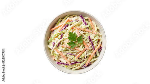 Creamy coleslaw salad with shredded green cabbage, red cabbage, and carrots, garnished with fresh parsley in a white bowl, top view