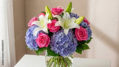 Elegant bouquet of roses lilies and hydrangeas in a decorative vase