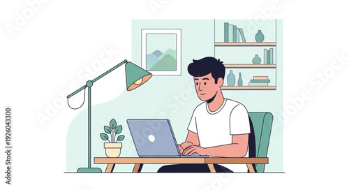 Young man working on laptop at desk with lamp and plant.