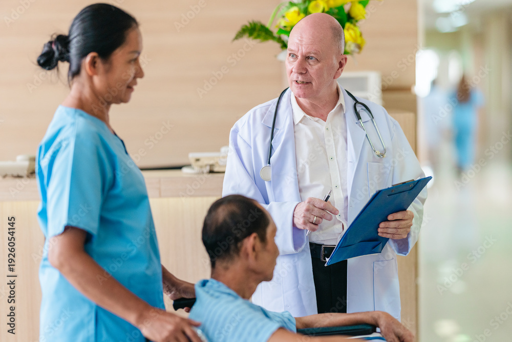 Obraz premium Medical Team Assisting Male Patient in Wheelchair
