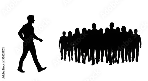 Silhouette of a male leader walking confidently ahead of a large group of people