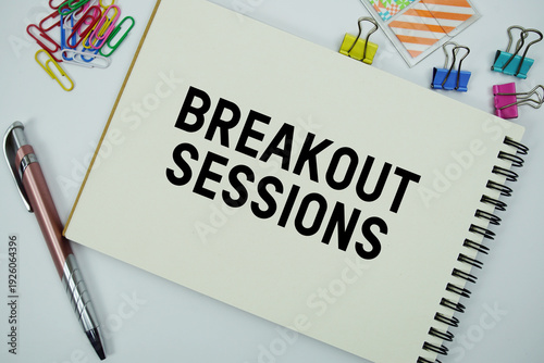 Tableau sur toile Breakout Sessions text message written on notepad with stationery flat lay on wh