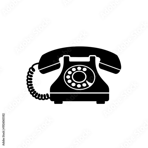 A black and white image of a rotary phone