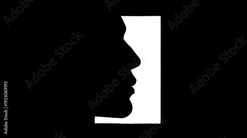 Abstract black and white profile silhouette of a human face, illustrating figure-ground perception and optical illusion. Conceptual art.
