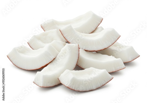 Freshly sliced coconut chunks with white flesh and brown edges