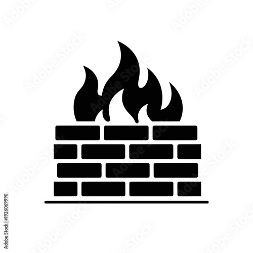 A black and white image of fire on top of a brick wall