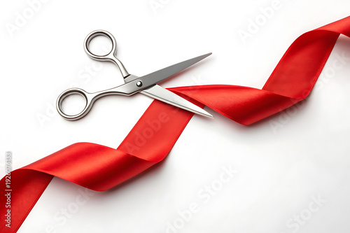 A pair of scissors cutting through a red ribbon on a white background, symbolizing a grand opening or special event
