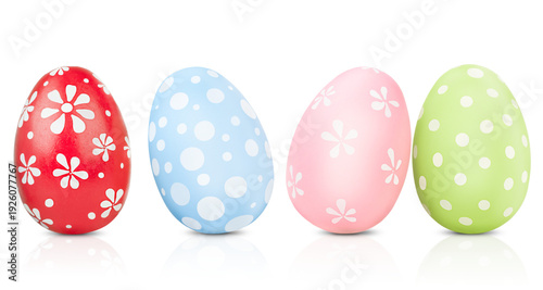 four painted Easter eggs standing on a white isolated background
