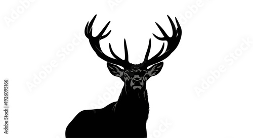 silhouette of a stag deer with large antlers looking forward