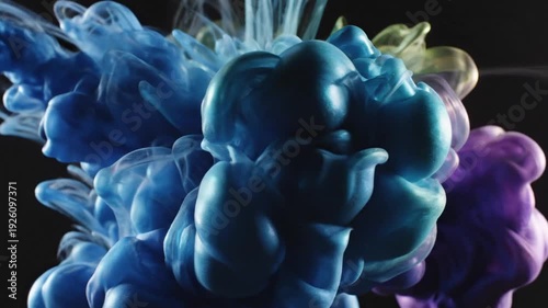 Colorful Ink Cloud Explosion in Water on Black Background