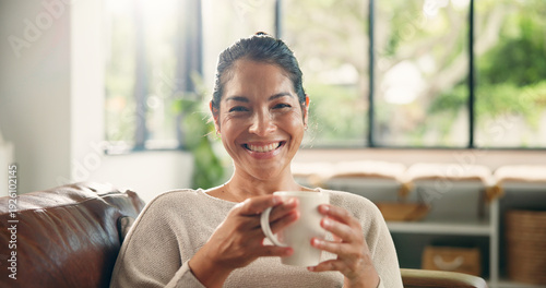 Quadro su tela Coffee, home and portrait of happy woman on sofa with drink for wellness, calm and relax in living room