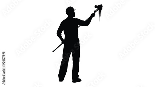 Silhouette of a worker holding a tool aloft possibly a jackhammer or drill