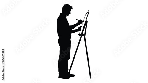 Silhouette of an artist painting on a canvas with an easel