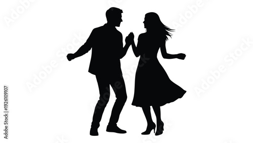 Silhouetted couple dancing a man and a woman joyfully moving together