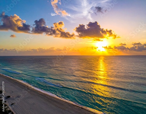 Stunning Sunrise Over Ocean - A Breathtaking Coastal View with Golden Hues and Serene Waters.