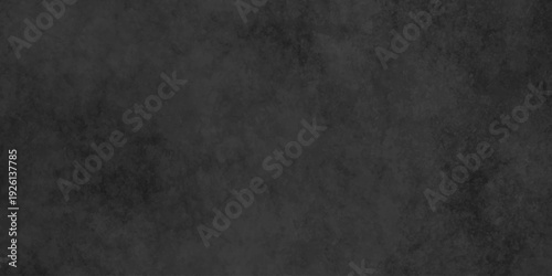 Dark charcoal grunge wall texture background. Dark black rough grunge surface with smoke edge. Black texture chalk board and black board.