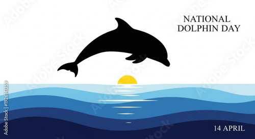 Dolphin jumping out of ocean waves at sunset on national dolphin day