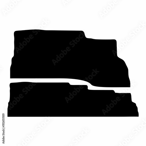 Black silhouette of two rock formations separated by a gap of light