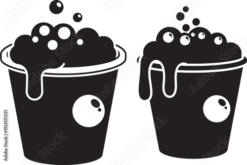 Silhouette buckets with foam and bubbles on white