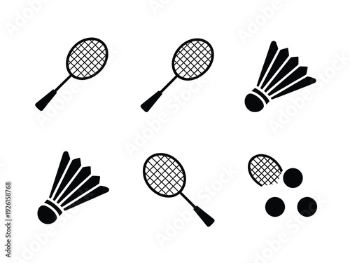 A collection of badminton rackets and shuttlecocks on a white background.