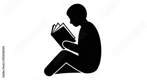 Person sitting and reading a book in a quiet moment of leisure and relaxation indoors