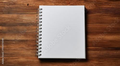 Blank Spiral Notebook on a Rustic Wooden Tabletop.