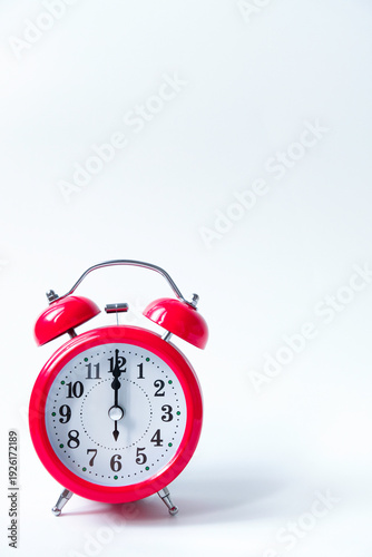 Wallpaper Mural The classic red alarm clock is isolated on a white background Torontodigital.ca