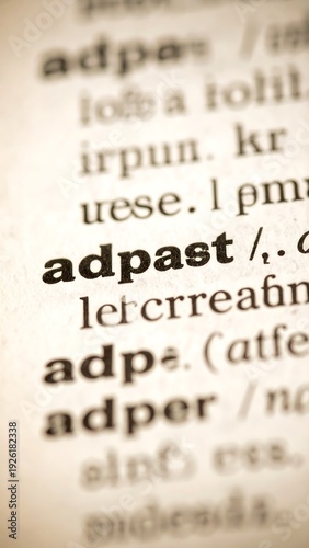 Close-up view of a dictionary page, highlighting the word 