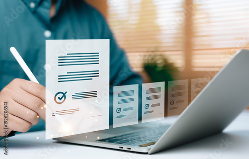 Fotografía Online document approval and digital checklist concept with virtual forms and check marks on laptop screen